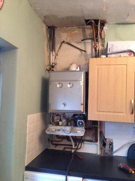 Anything would be an improvement on this mess but a shiny new Baxi Duotec with 7 year warranty will do nicely.