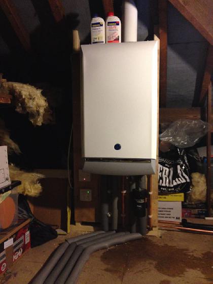 Old boiler and hot water cylinder removed and a new Atag combi boiler in the airing cupboard